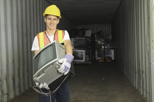 Waste collection truck operating in Dalston